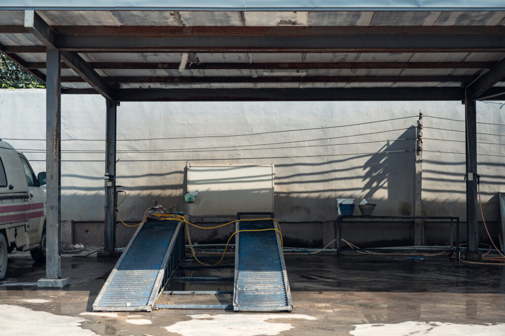 Empty car wash facility with vehicle ramp