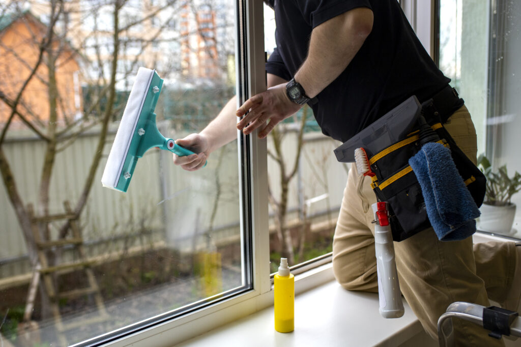 Professional home cleaning service worker cleaning interior